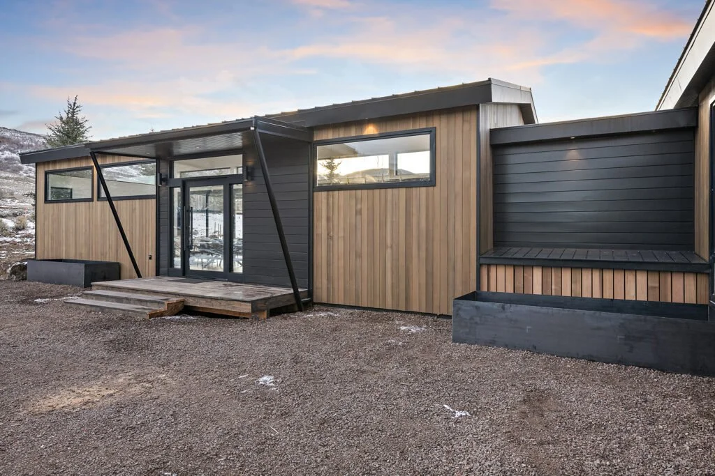 Icon-House-Benloch-Heber-City-Exterior-Front-Entry-Wood-Siding-Black-Planters-Covered-Porch-Roderick-Builders-Modern-Custom.jpg
