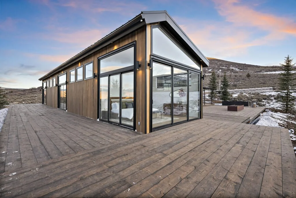 Icon-House-Benloch-Heber-City-Exterior-Wood-Siding-Glass-Walls-Deck-Sunset-View-Roderick-Builders-Modern-Custom.jpg
