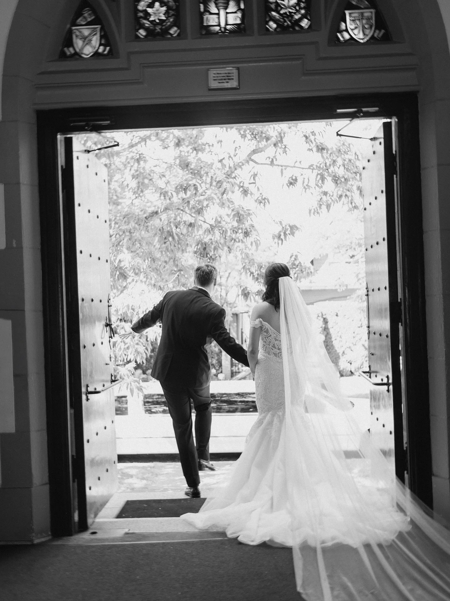 beneath stained glass light of church, a love story quietly unfolds in timeless grace.

photography: @meg.fototelling
content creator: @eventfuledits
hair &amp; mua: @katsunobeauty
florist: @dancingflorista
wedding planner: @woodseventsandco @fanizis