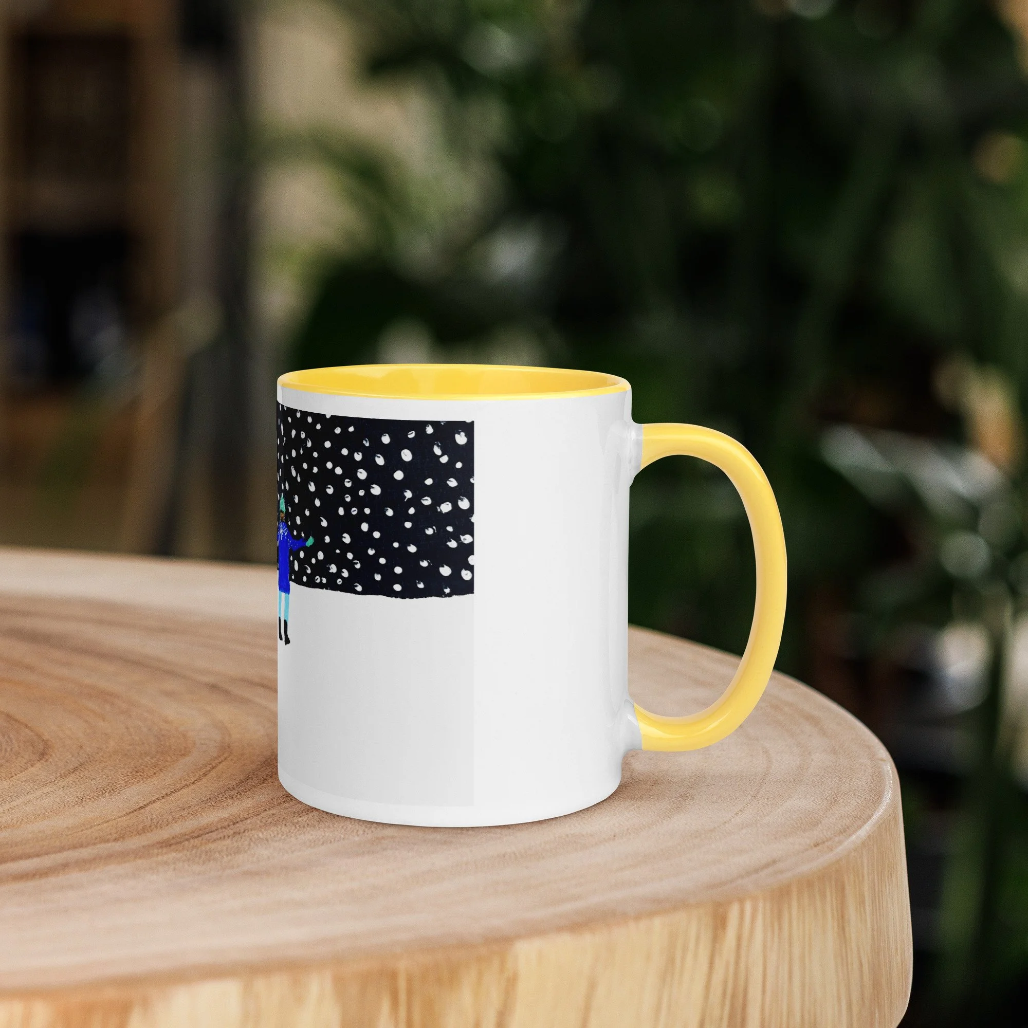 White ceramic mug with a yellow interior, side view