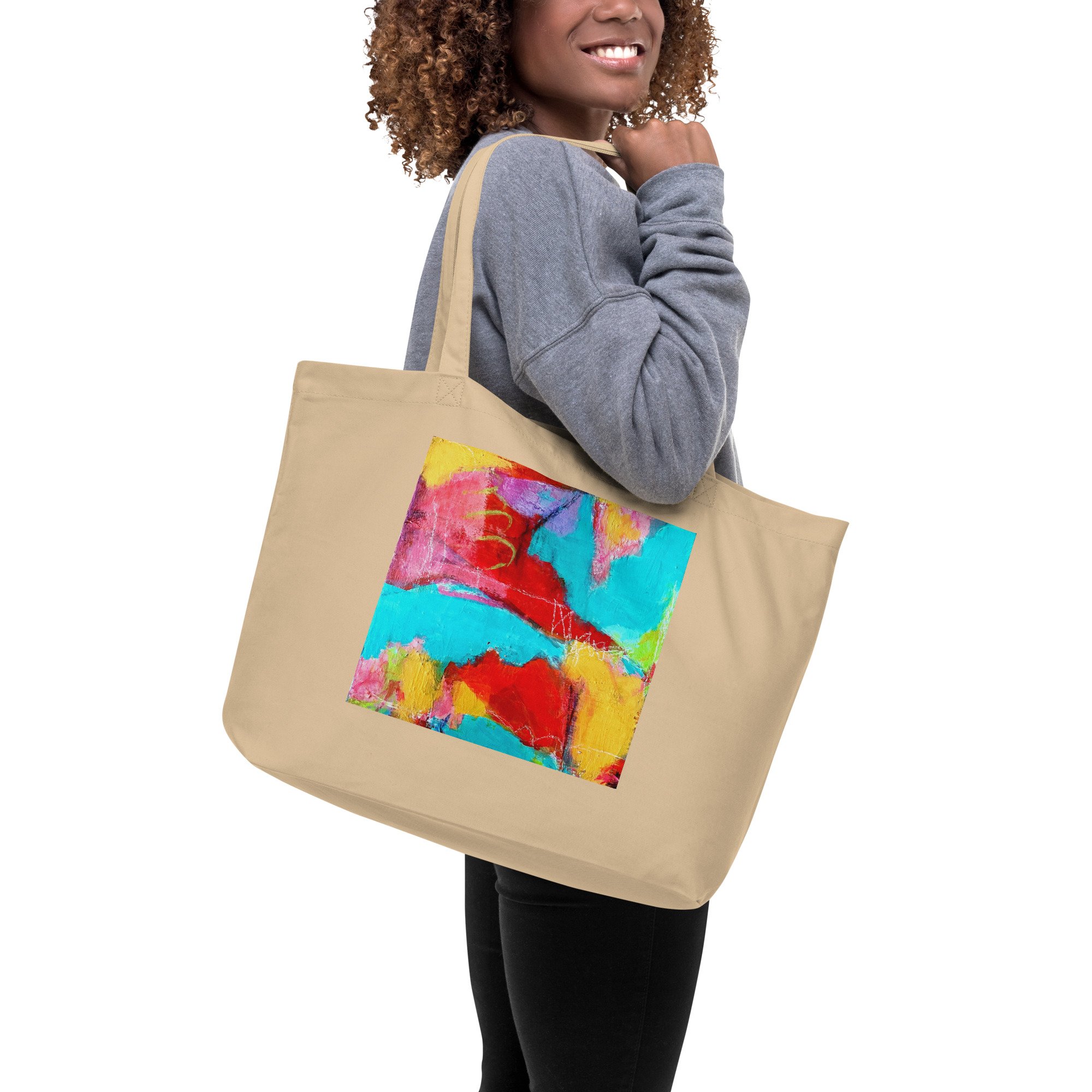 woman holding a tan tote bag with Abstact #2 featured as art