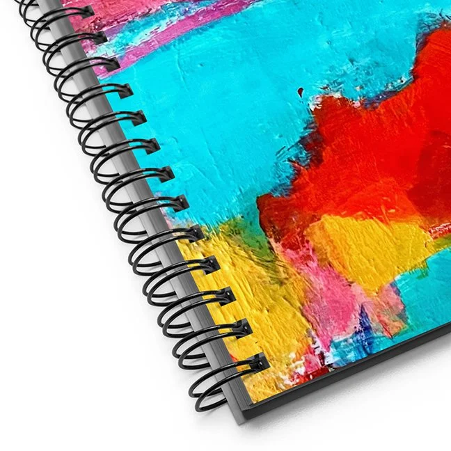 corner detail showing black spiral spine of notebook