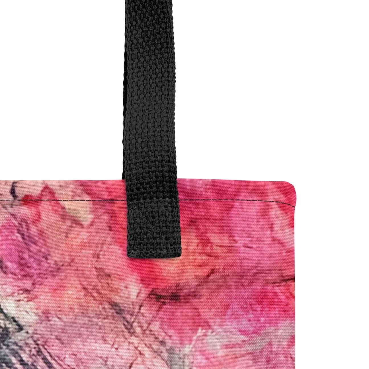 detail of the black fabric handle on the tote bag