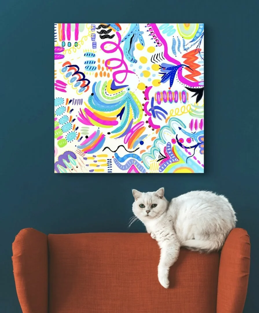 Mary's painting on a wall with a cat on a chair in front of it