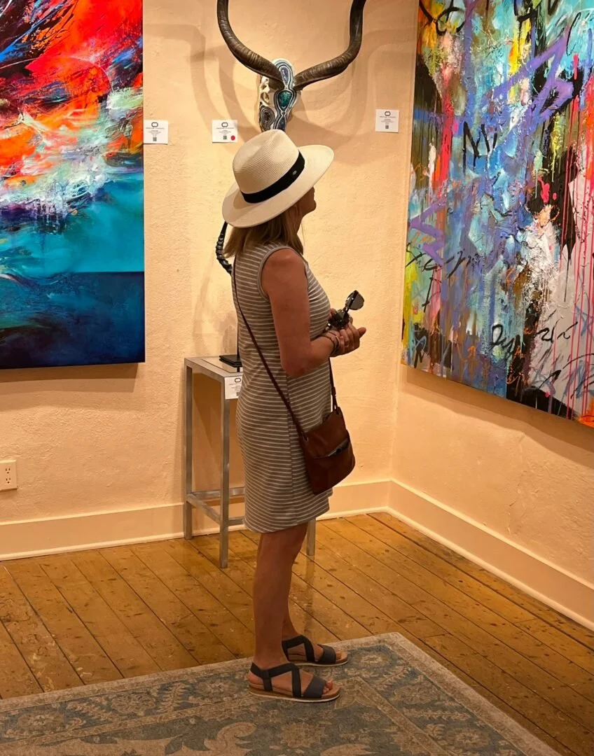 Mary Brooks looking at art in a gallery