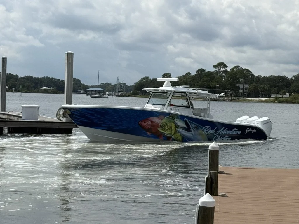 Reel Adventure Charters 42' Yellowfin running past the dock in Pensacola