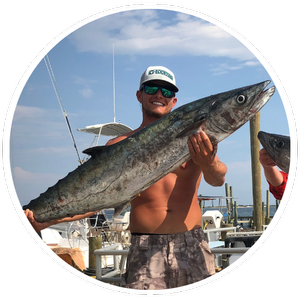 Captain Jake Durant with a catch at the dock