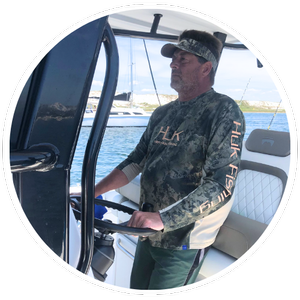 Captain Rick Durant at the helm