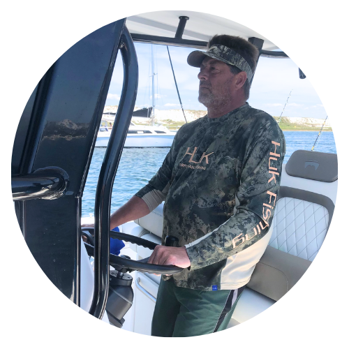 Captain Rick Durant at the helm