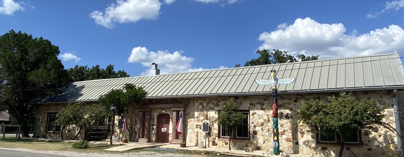 Museum with new totem pole edit.jpg