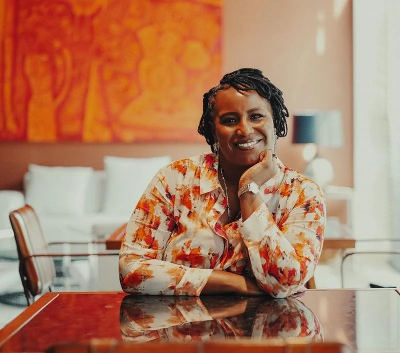 founder alexia smith smiling and sitting