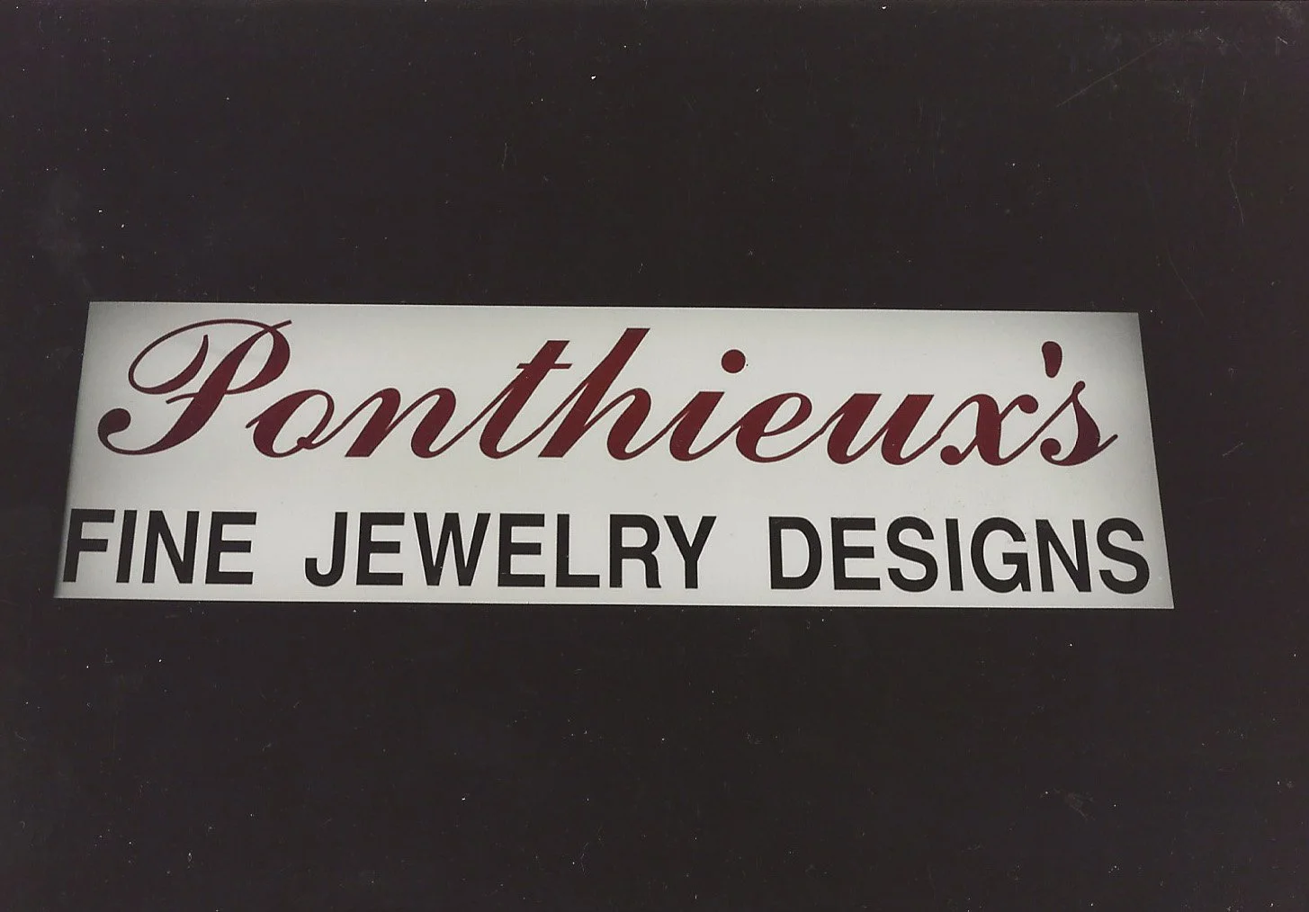 Sign reading 'Ponthieux's Fine Jewelry Designs'