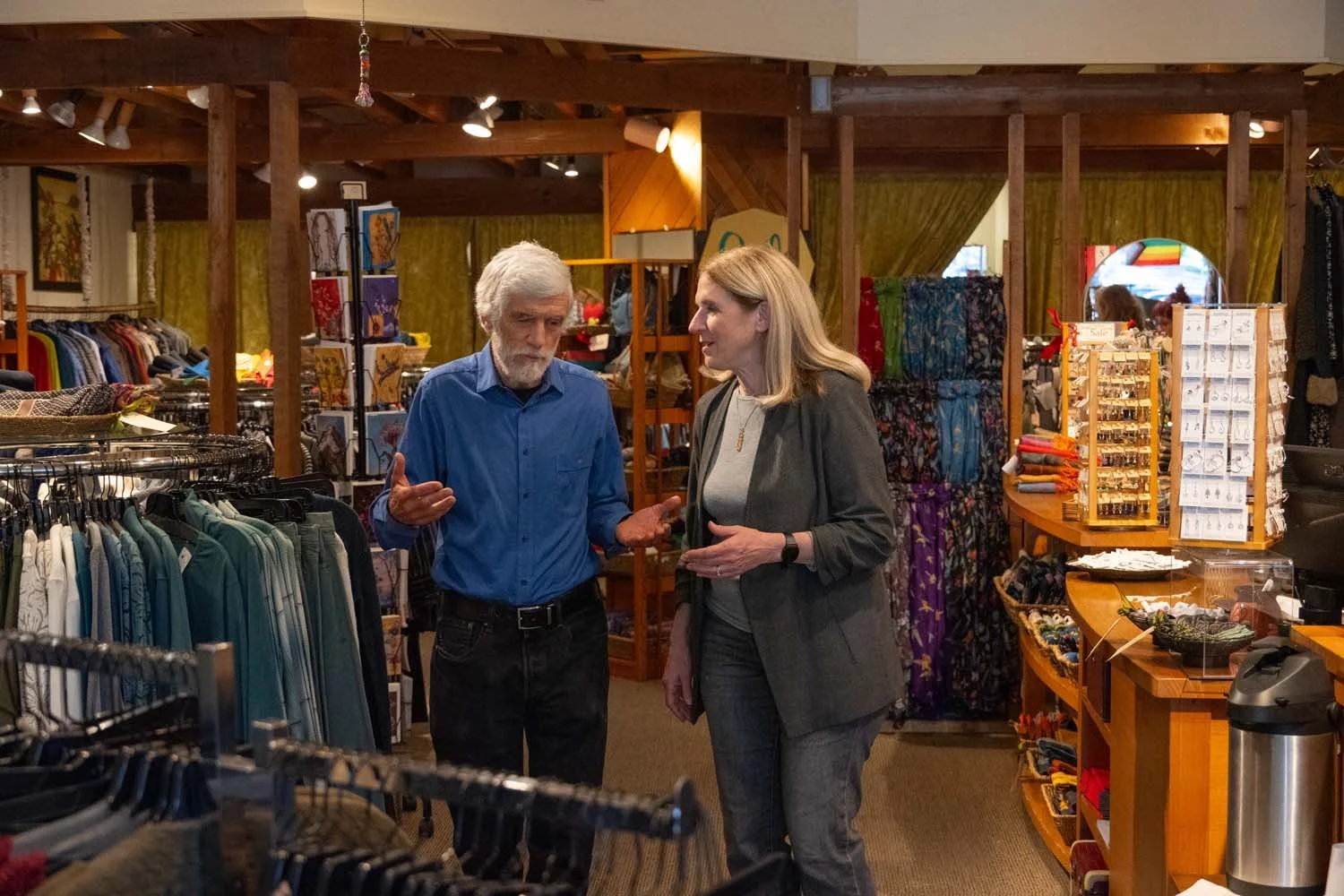 Julia in store front with a man