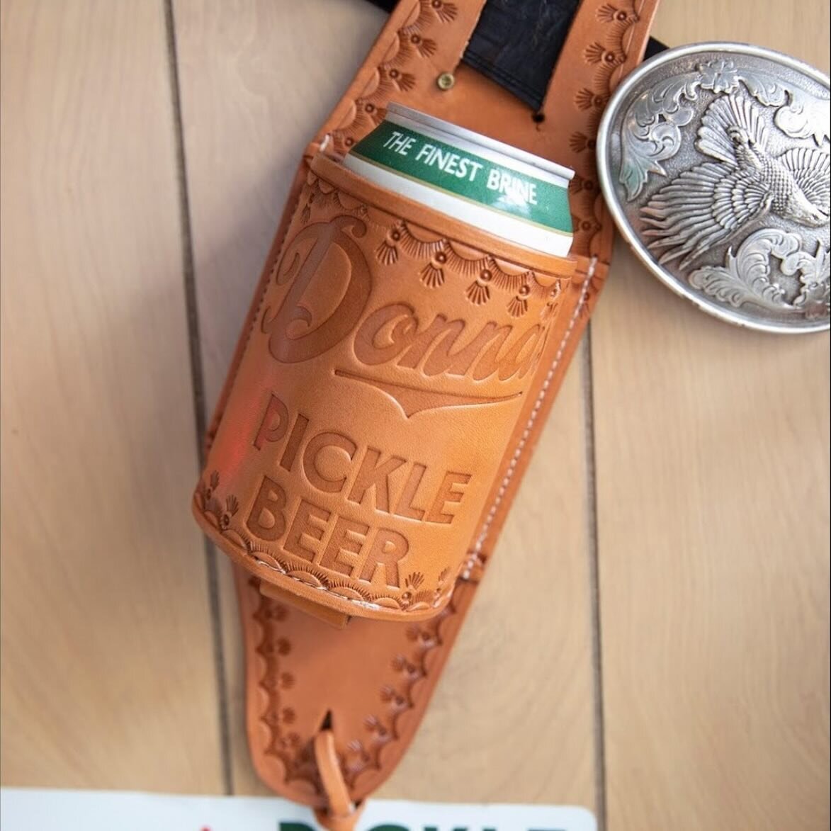 Y'all seen them fancy beer holsters, handcrafted by @staggerleegoods? Perfect for toting your 🥒🍻 like a true outlaw.