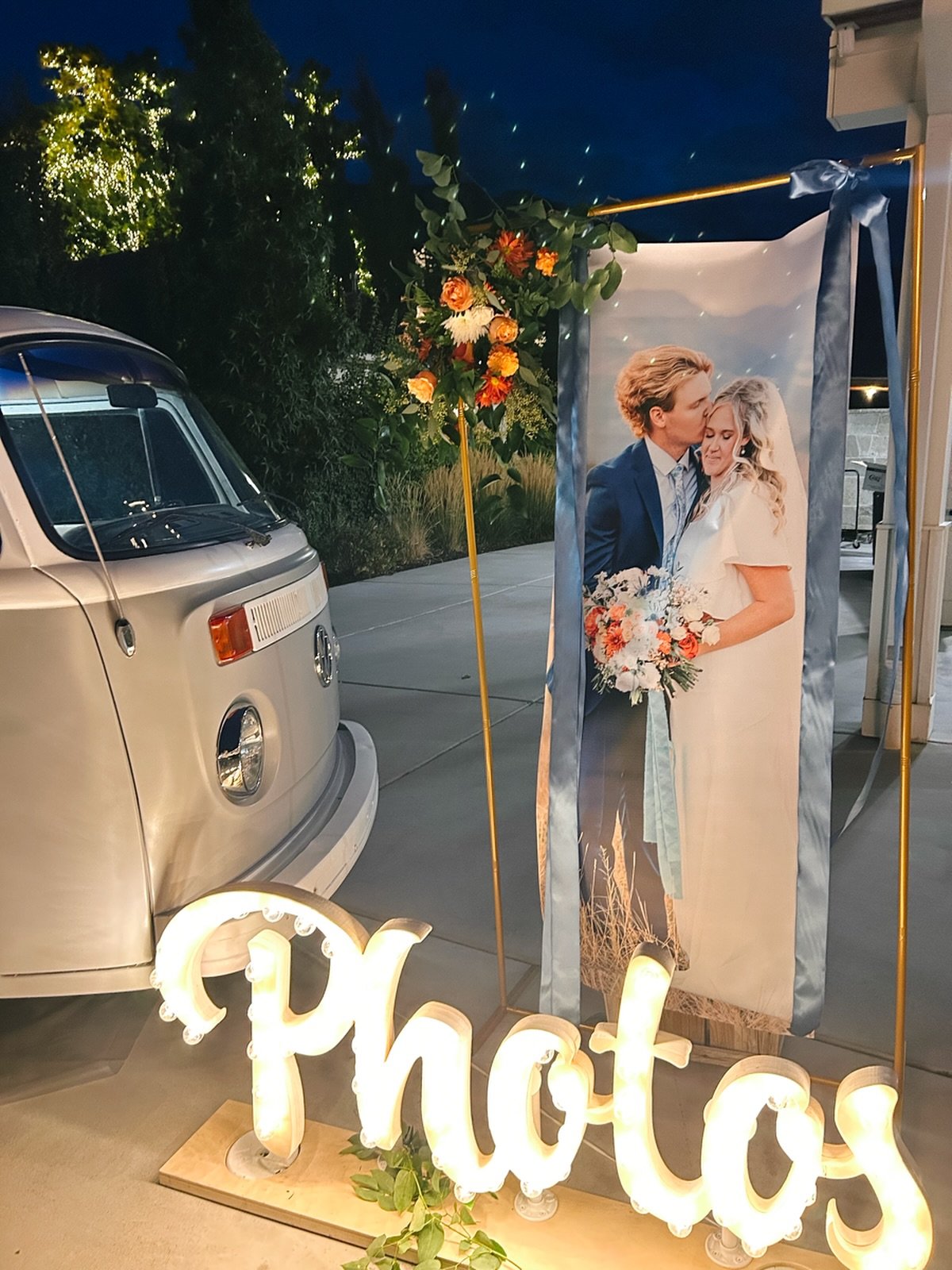 The wind was particularly blustery last week so we did what we do best and pivoted! Sign on the ground by the bus with the lights on, some greenery and a gorgeous photo of the couple behind it. Where there&rsquo;s a will there&rsquo;s a way!!! Also, 