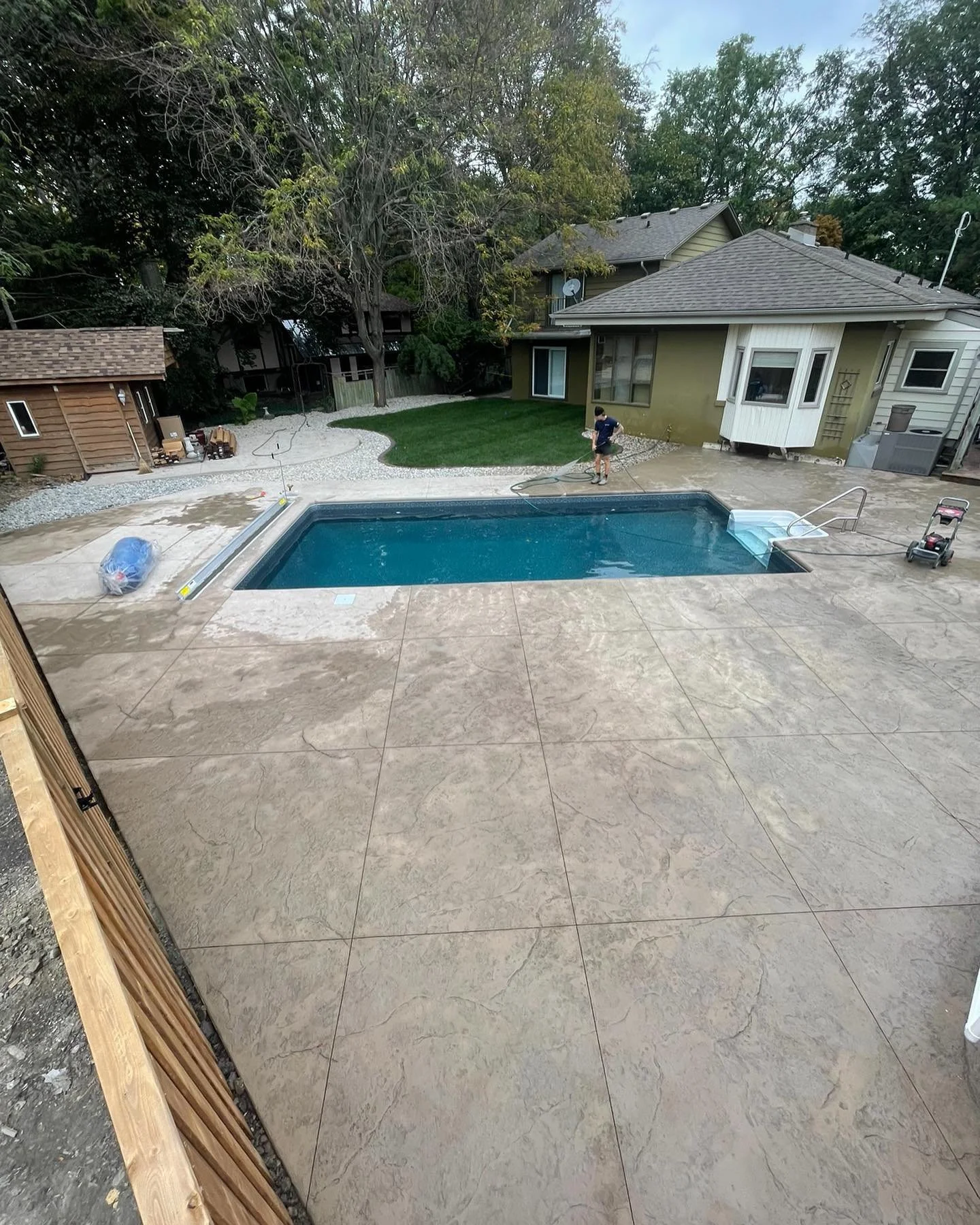 We revamped this existing 15x30 inground pool showcasing seamless sandstone colour stamp, stylish curbs done by @kerbkrew. New liner. Vibrant sod and beach stone done by @sunriselandscapingwindsor. Dive into luxury in your own backyard!