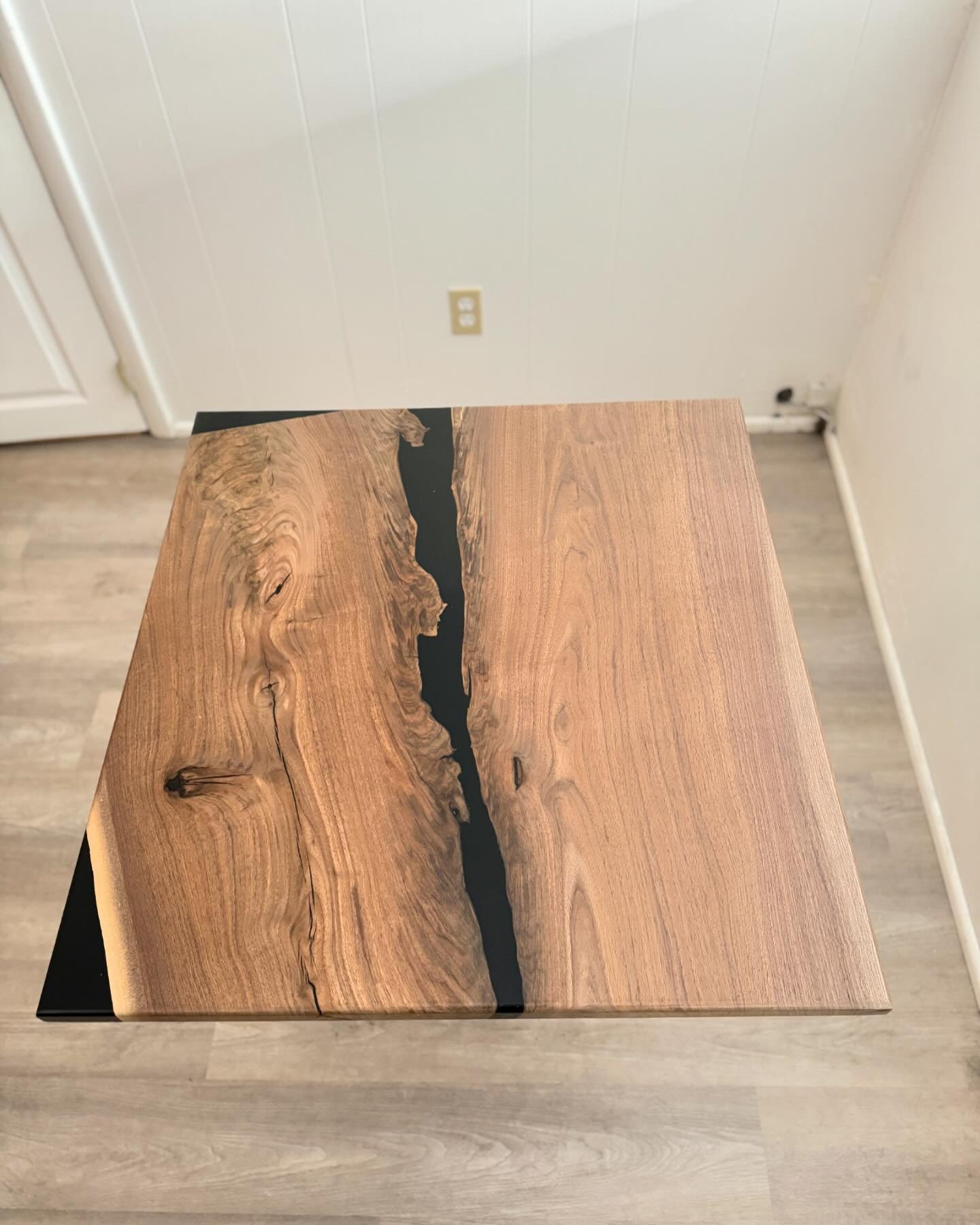 I recently moved into a new apartment, and we needed a new dinner table! Did I go a little over board? Maybe. Was it totally worth it because this is the coolest table ever? ABSOLUTELY.  This table features locally sourced walnut, with black epoxy fi