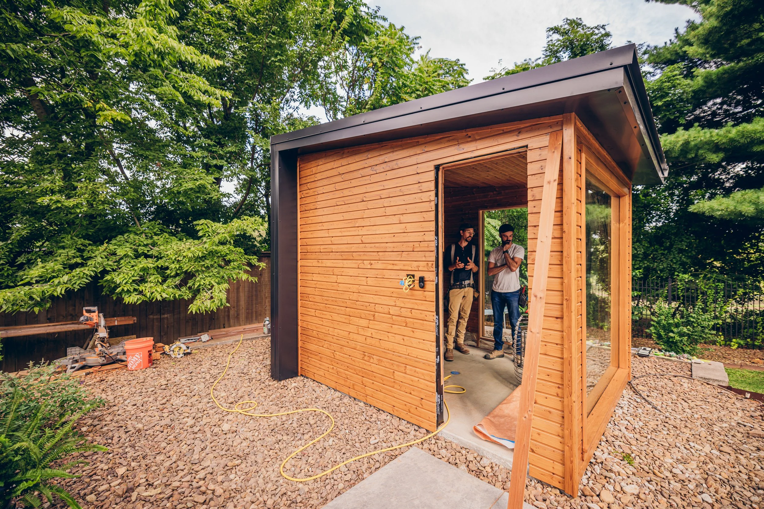 ChillFire Saunas builders standing in front of a completed home sauna installation