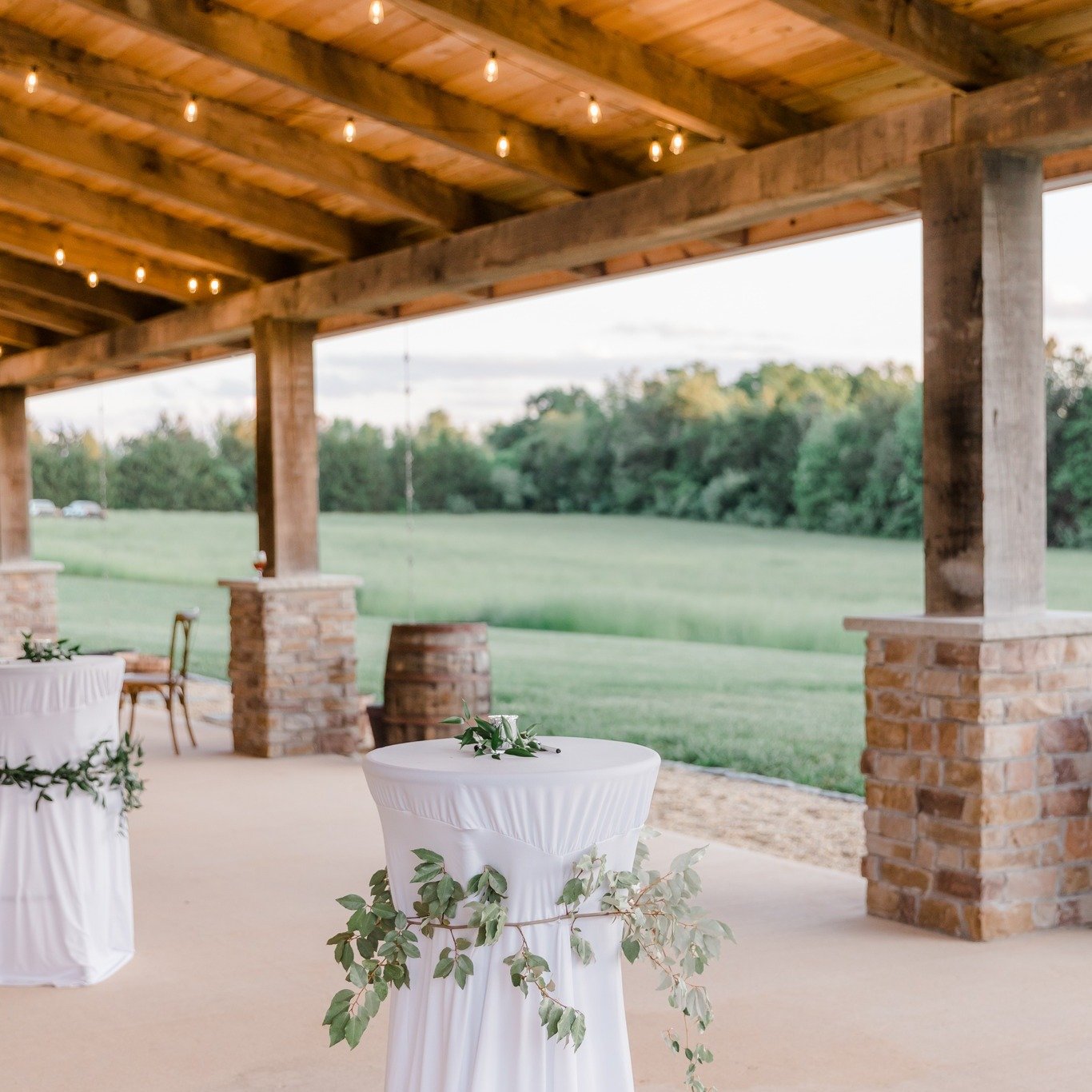 This delightful space offers a cozy, covered retreat where your guests can mingle, enjoy handcrafted drinks, and soak in the stunning surroundings. With its rustic charm and picturesque setting, it&rsquo;s the perfect spot to kick off your celebratio