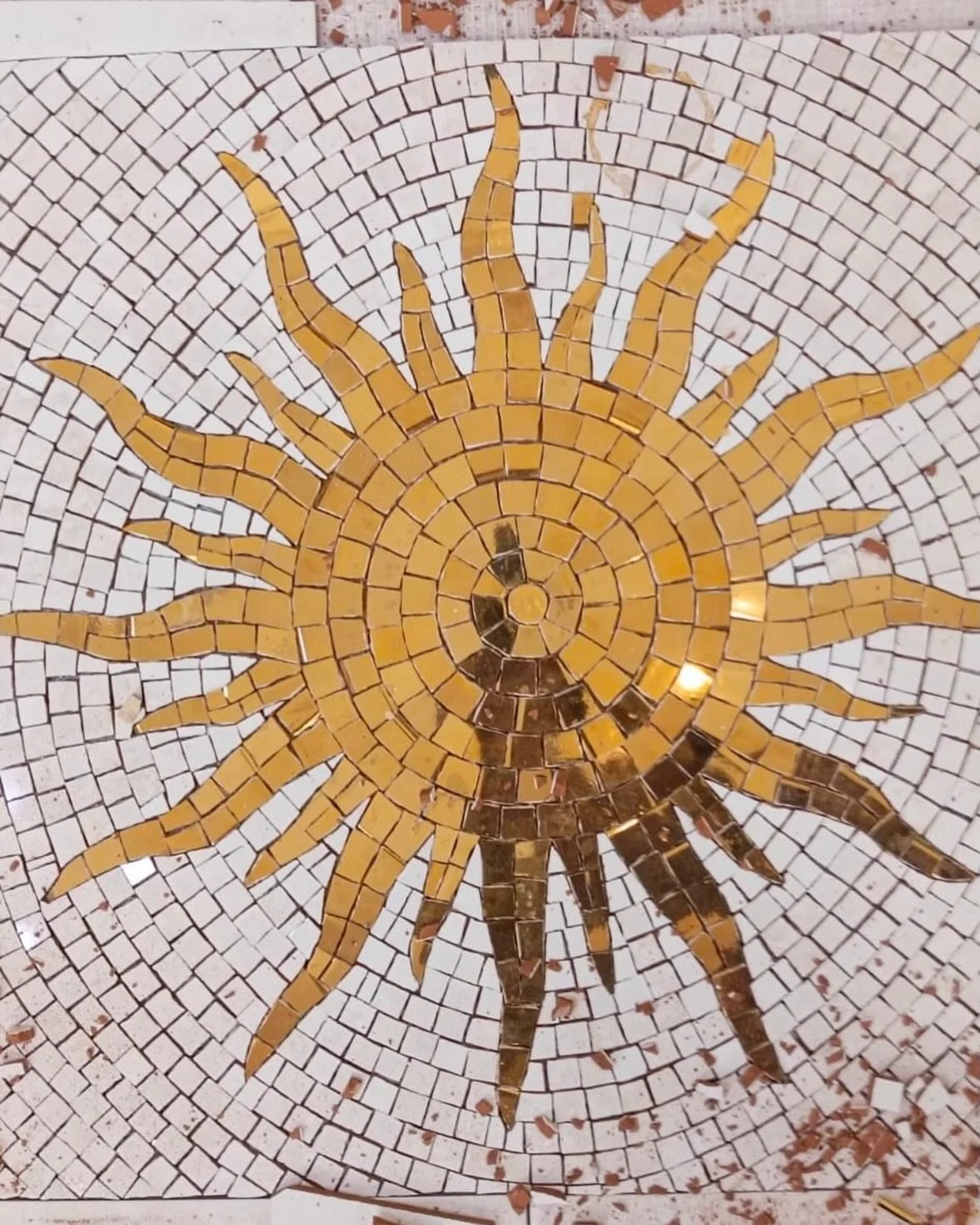 Just a golden mosaic sun #custommosaic bathroom floor.