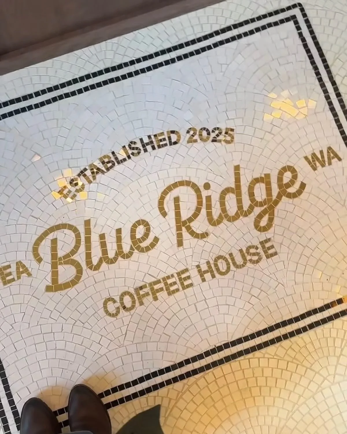 Mosaic floor with gold lettering @blueridgecoffeehouse