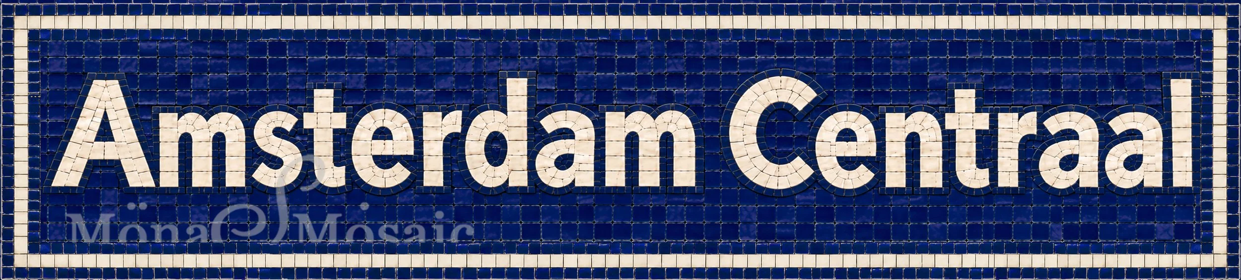 Amsterdam Centraal custom hand-cut tile mosaic sign measuring 62 x 14 inches, featuring ivory-white subway-style lettering on a navy blue square tile background with subtle tile outlines.