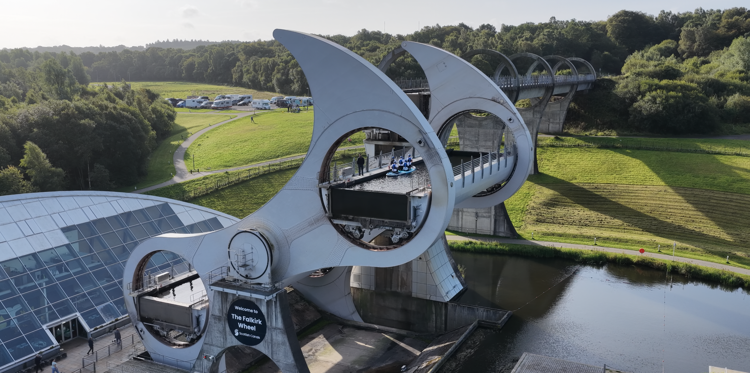 Aerial view of TeamEdge paddling the Mega-SUP through the Falkirk Wheel during the Edge to Edge Expedition.