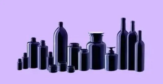 a row of biophotonic glass bottles in different sizes and shapes