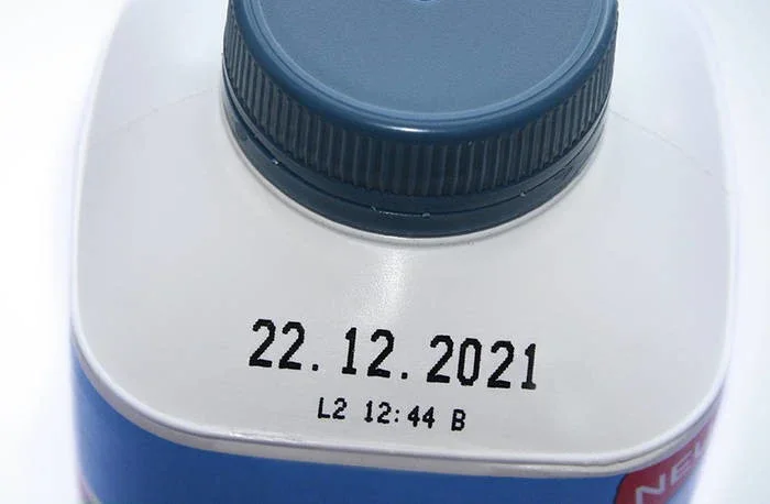 CIJ Black print on a white plastic bottle