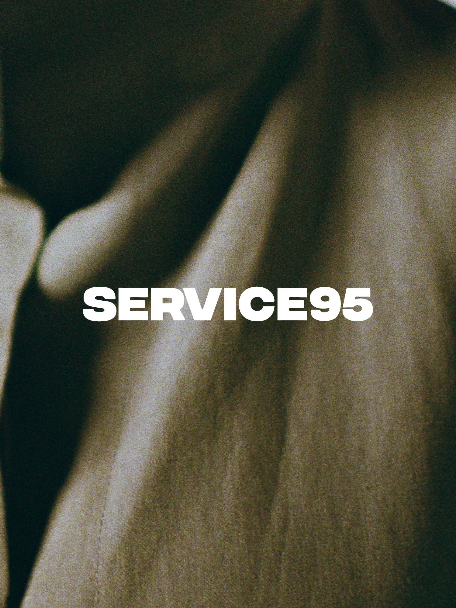 Close-up of fabric with the word 'SERVICE95' in bold white text