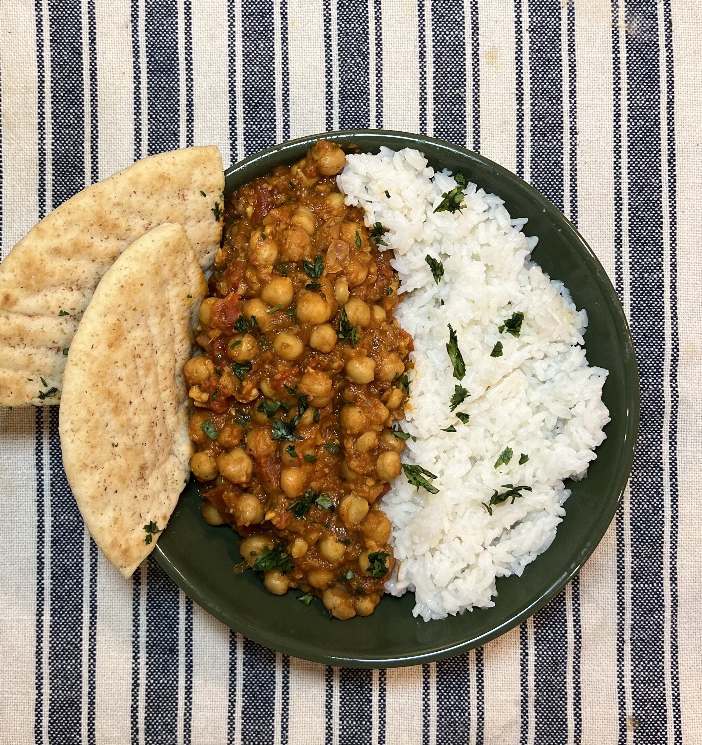 Chana masala made with chickpeas simmered in a spiced tomato sauce