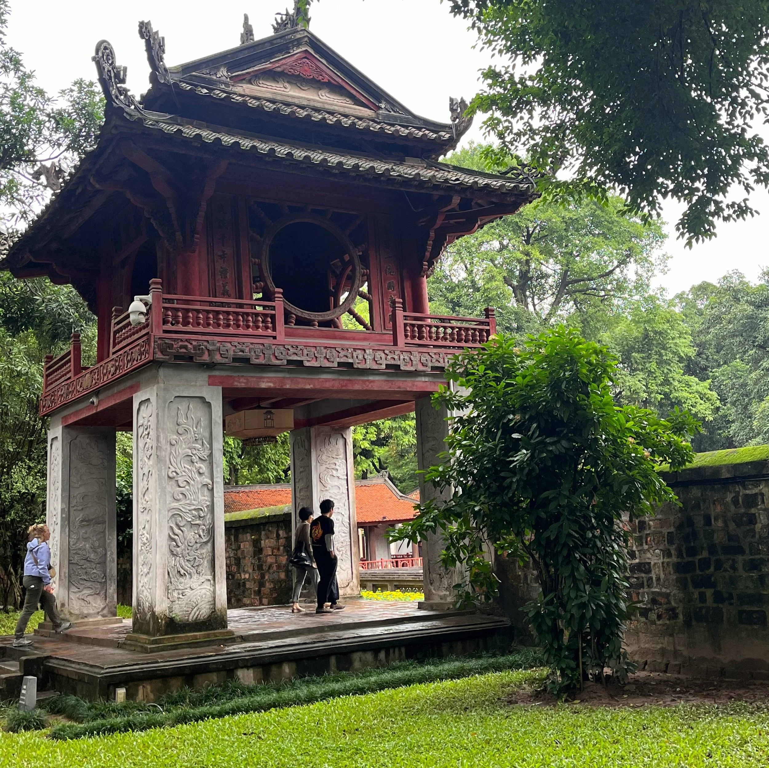 Entrance and courtyard of the Temple of Literature in Hanoi, Vietnam, showcasing traditional Vietnamese architecture and serene gardens.