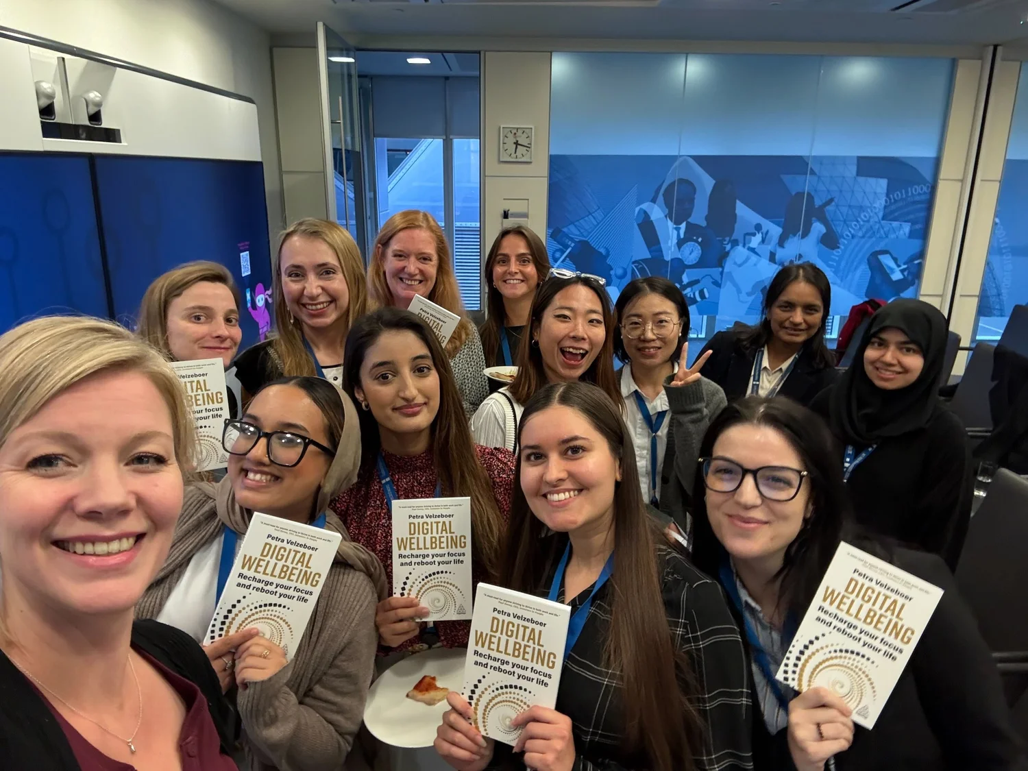 Petra with a group of women holding copies of Digital Wellbeing at the book launch