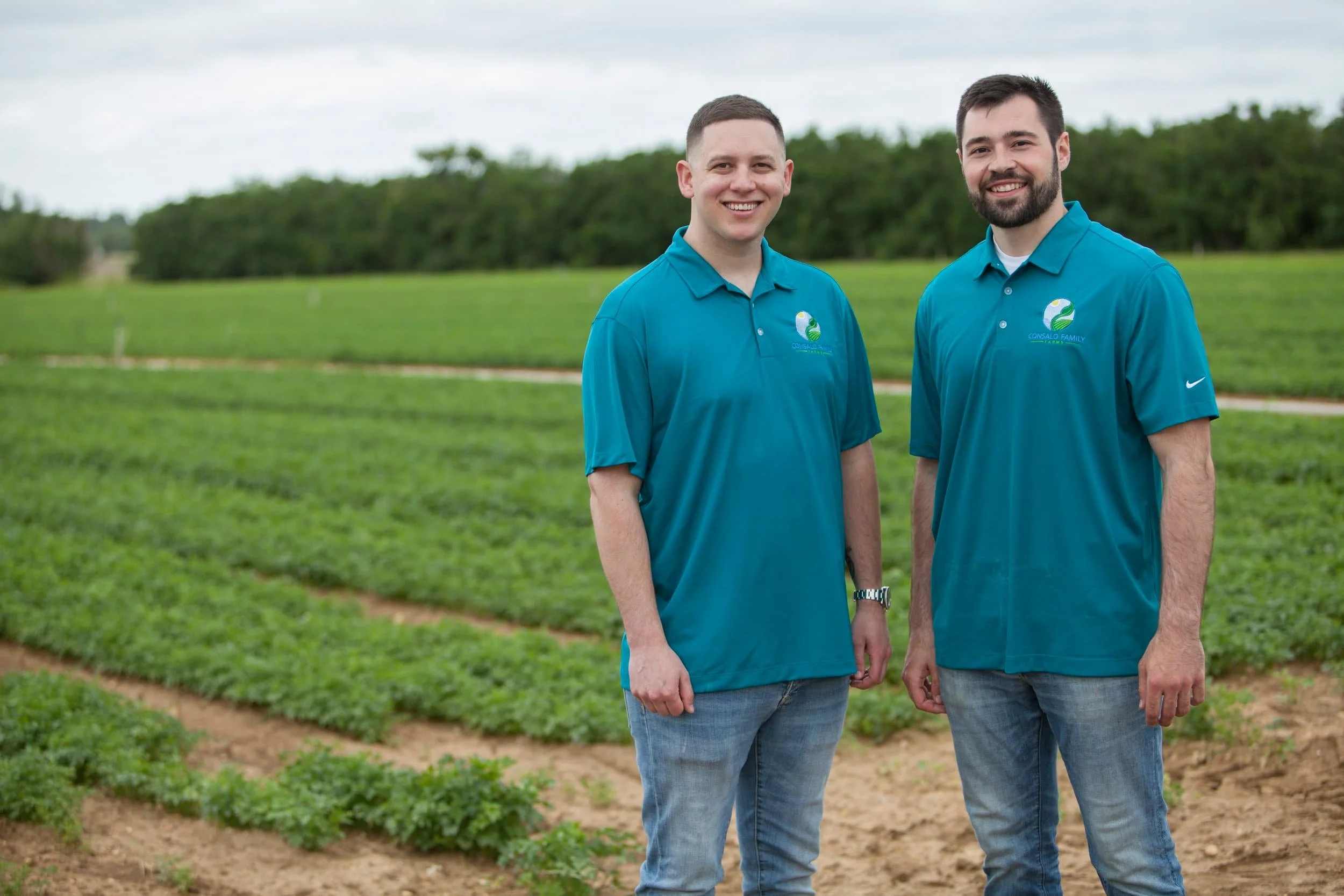 2 men standing in front of field at Consalo Family Farms