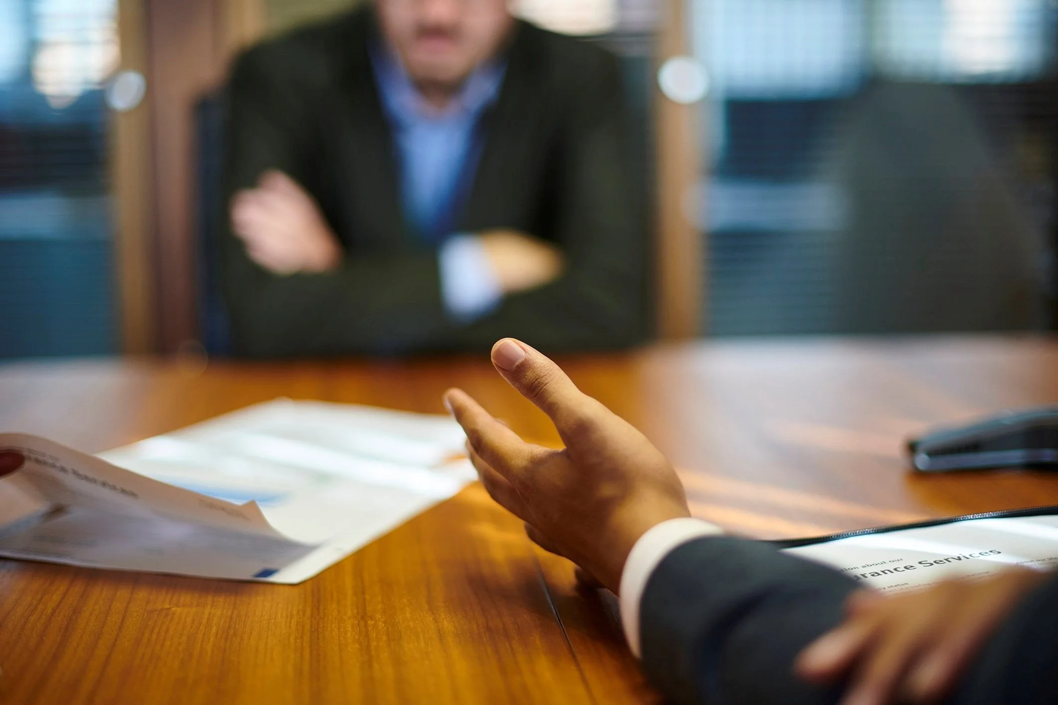 Security investigator conducting a structured workplace interview, representing Second Sight's Interview Planning and Credibility Assessment program for security investigations