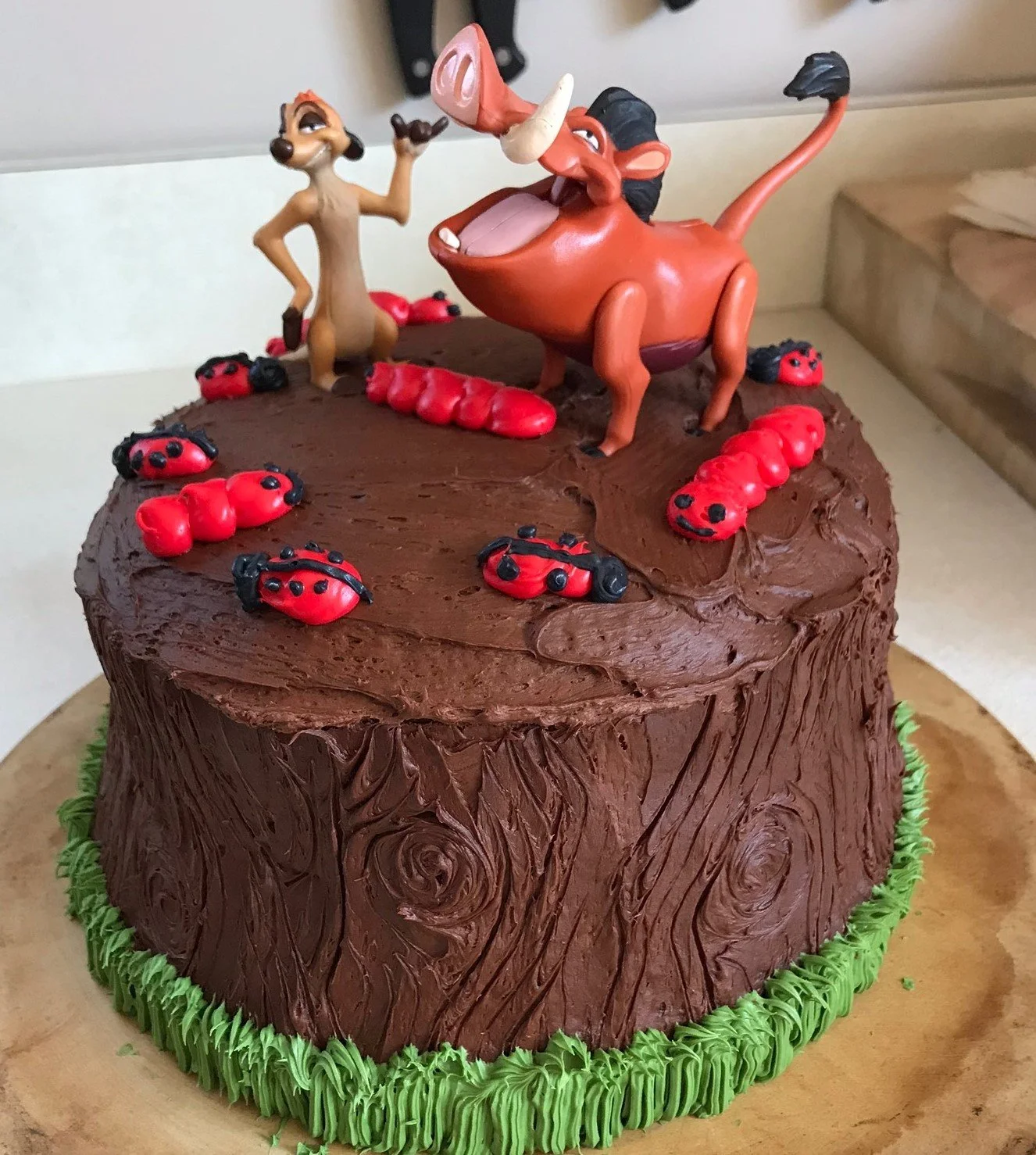 Lion King cake with Timon and Pumba figurines