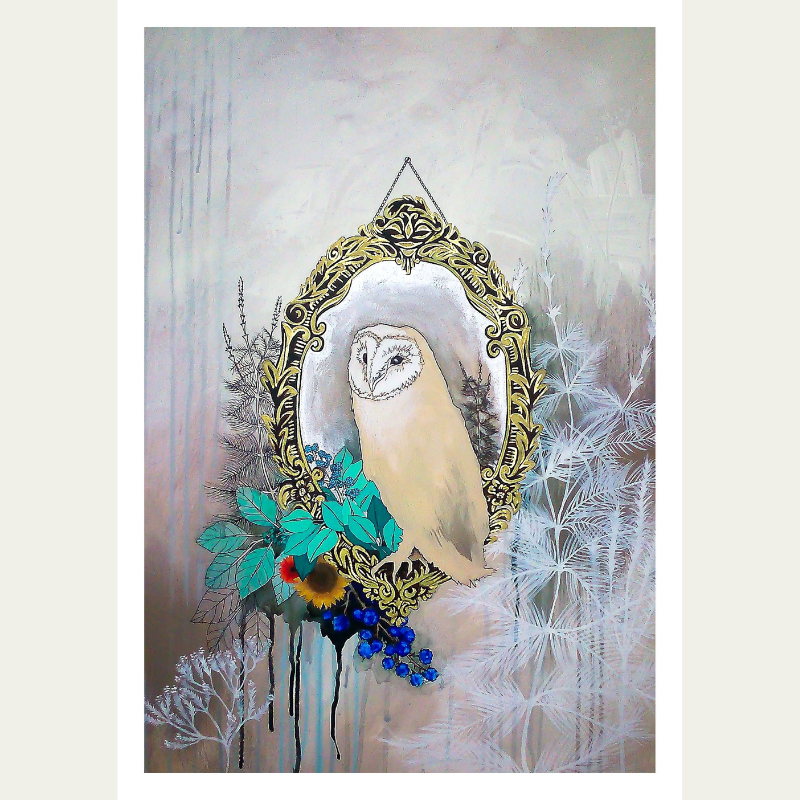 A decorative mirror with an ornate black and gold frame is hanging on the wall. Inside the mirror, there is a painting of an owl with a white face and soft brown and white plumage. Surrounding the mirror and owl are illustrated foliage including gree