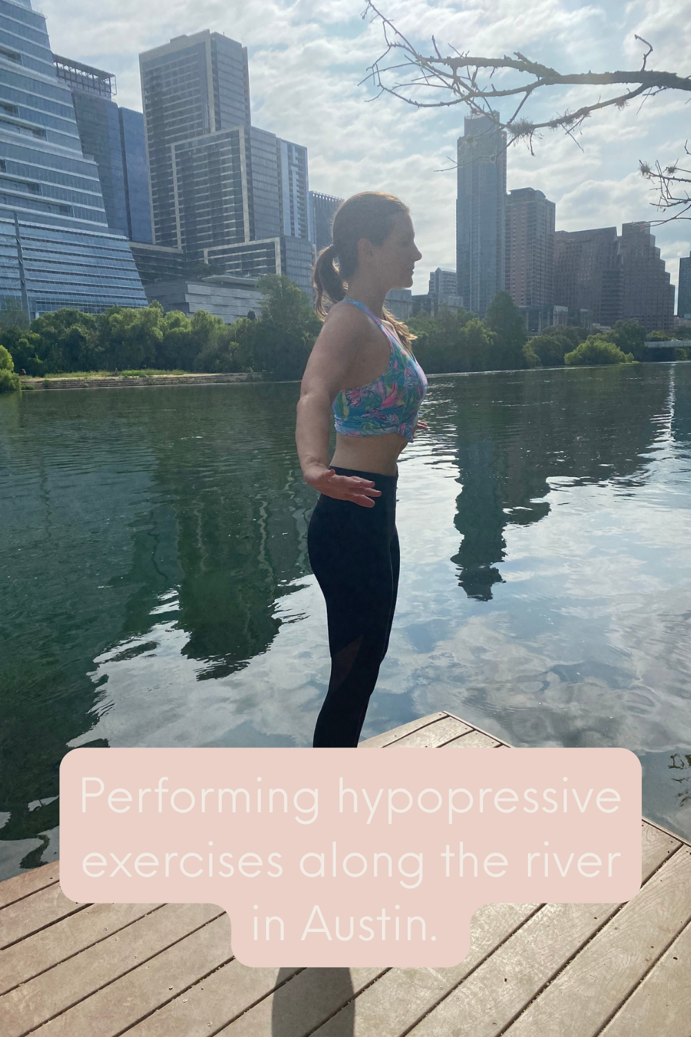 Physical therapist performing a hypopressive exercise posture outdoors along a river in Austin, Texas.