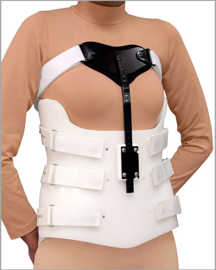 A person wearing a medical back brace with adjustable straps and a front metal support.