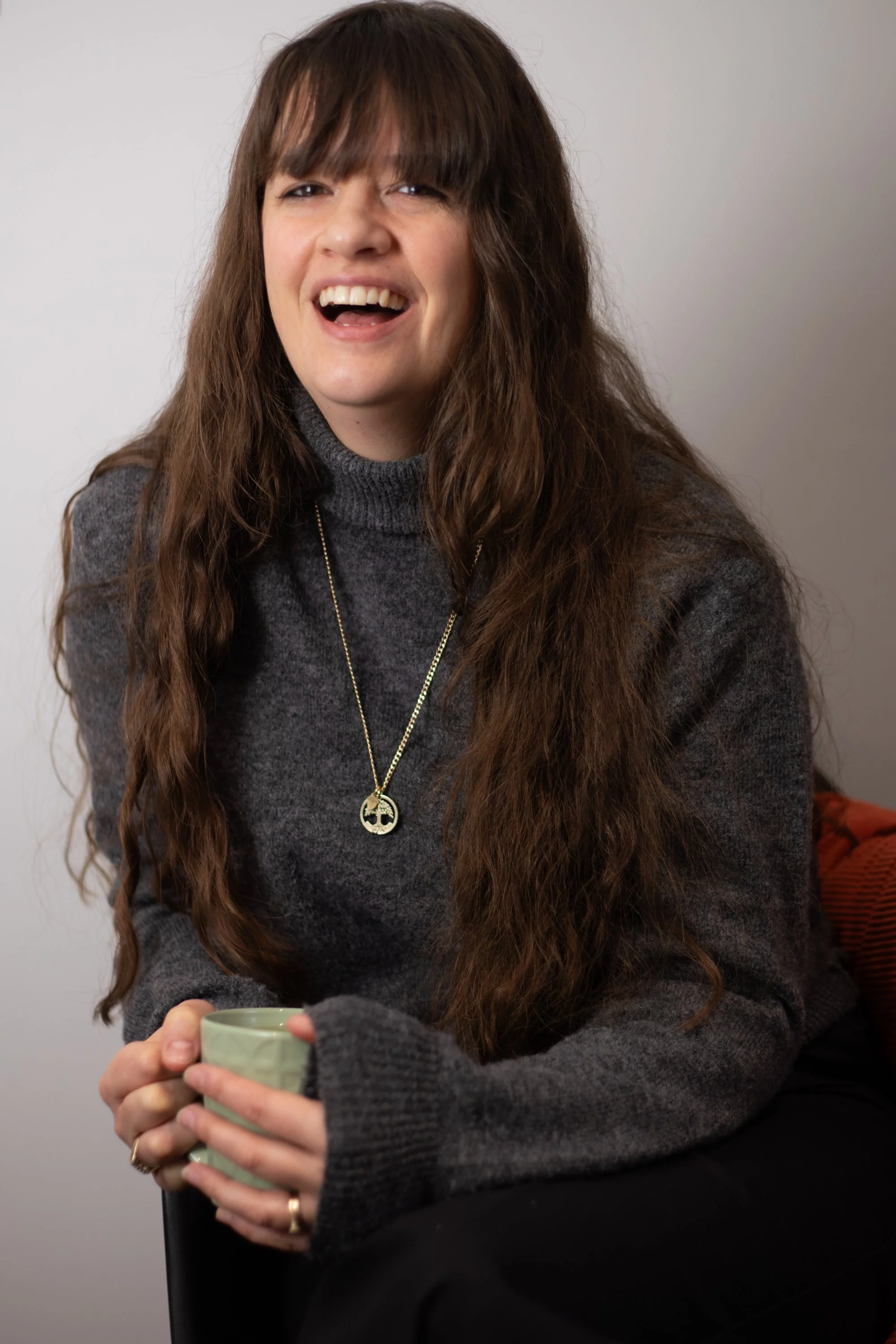 Suzanne Jode, pschotherapist drinking a hot tea in her theraoy room, Enchanted Circle, Attleborough, Norfolk
