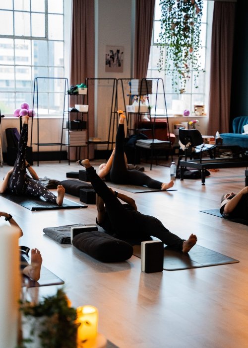 Students Practicing Restorative Yoga in the Creator Studio at The Kali Collective
