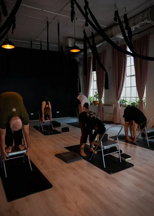 Students Practicing Yoga in the Creator Yoga Studio in the Kali Collective
