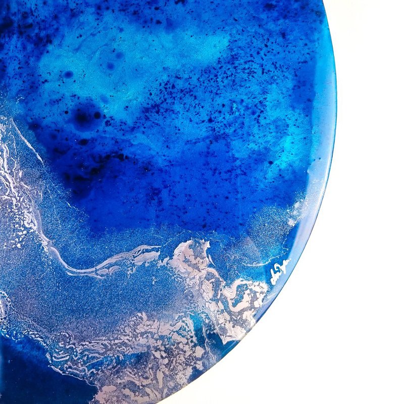 Discover "Cerulean Depths," a resin artwork showcasing shimmering turquoise and aqua tones. Perfect for creating a serene coastal atmosphere in your space.