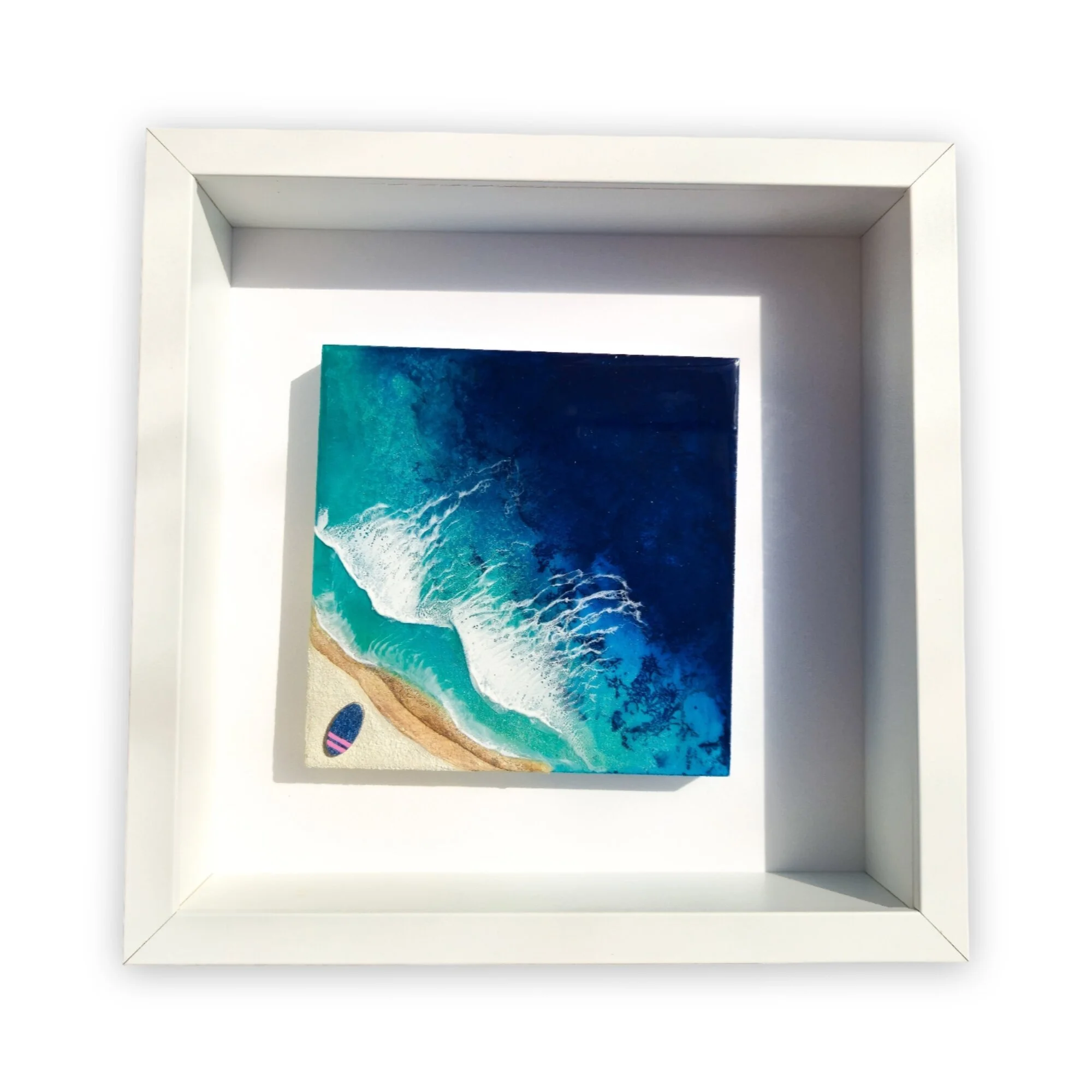 Full view of Never Stop Dreaming framed resin surf art showing surfer in motion across layered ocean