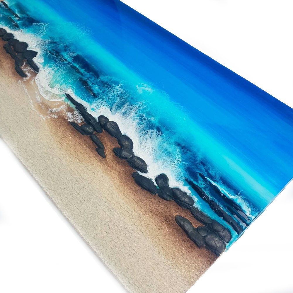 Close up of ocean-inspired resin painting with turquoise and blue tones, capturing the beach beauty.