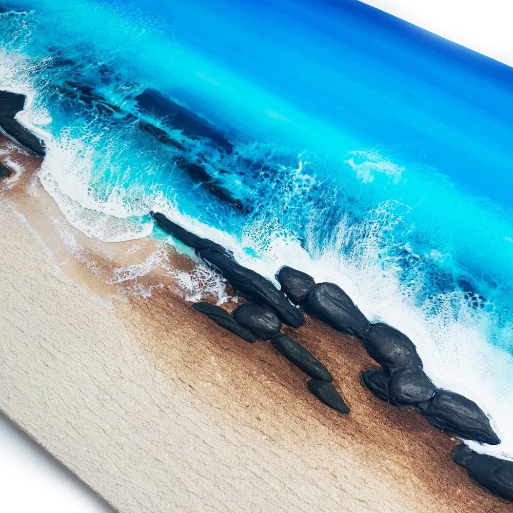 Detailed shot of an ocean resin artwork, showcasing unique patterns and blue accents.