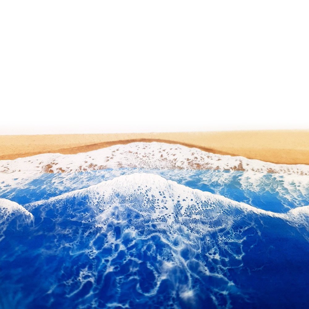 Close up of ocean-inspired resin painting with turquoise and blue tones, capturing abstract beach beauty.