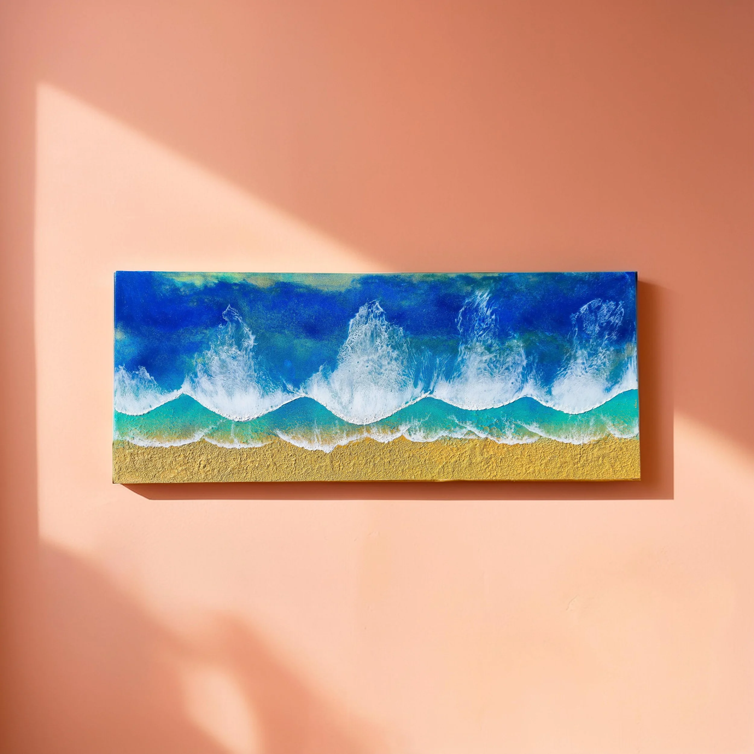 Rectangular ocean wall art with four rolling waves in deep blue, turquoise, and golden sand on textured shoreline.