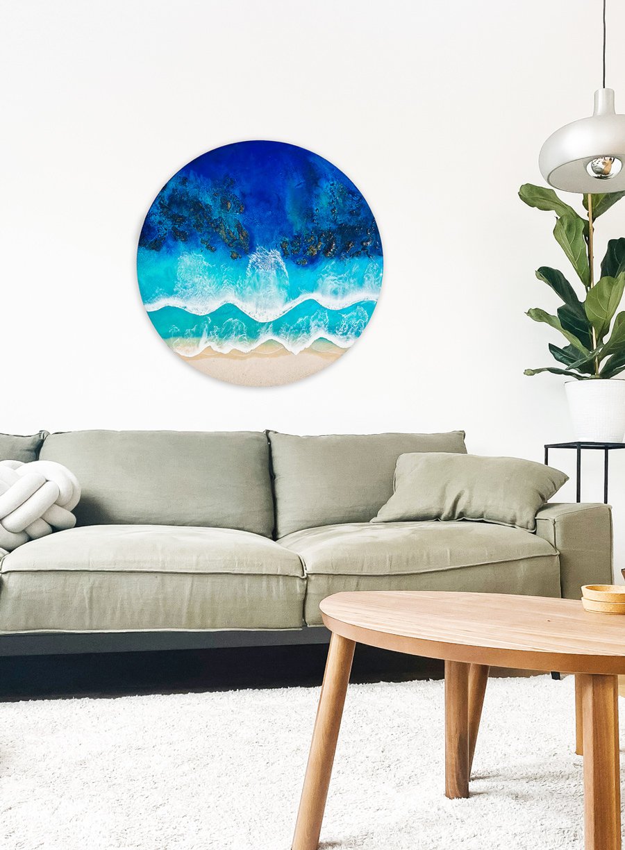 Experience the ocean's energy with "Echoes of Atlantis," an ocean resin artwork by Orla Doyle. Vivid blues and cascading white crests bring seaside tranquility into your space.