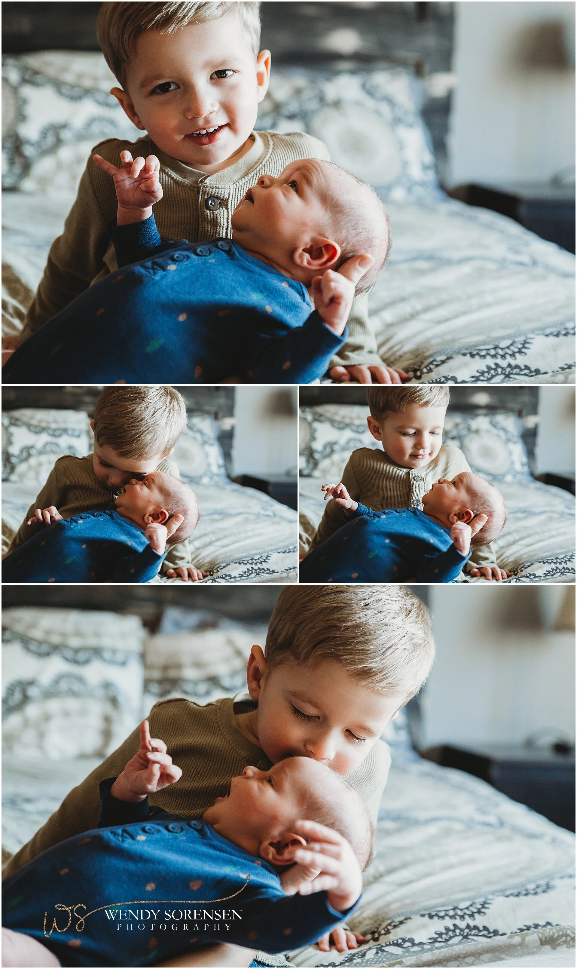 Little boy holding his baby brother with help from mom and dad.
